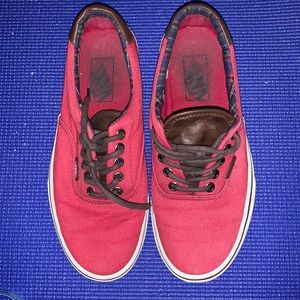 Red Vans with white soles